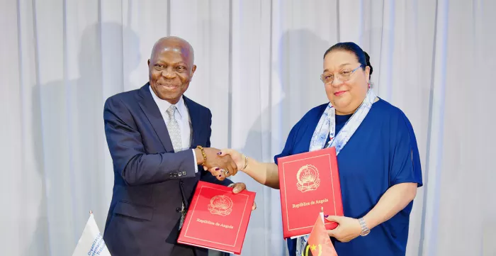 Minister of Public Administration, Labour and Social Security of Angola, Teresa Dias Rodrigues, with ILO Director-General Gilbert F. Houngbo, shake hands after signing of country office agreement in Luanda