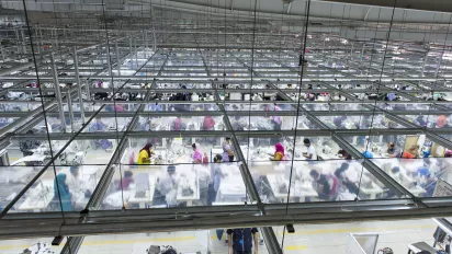 plunging view of textile workers in a factory